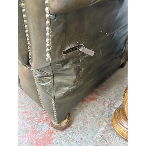 152 - A 1930s green leather Chesterfield drop arm sofa