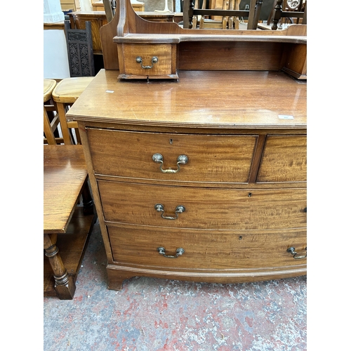 209 - An Edwardian mahogany dressing chest with upper oval bevelled edge mirror, two short drawers and two... 