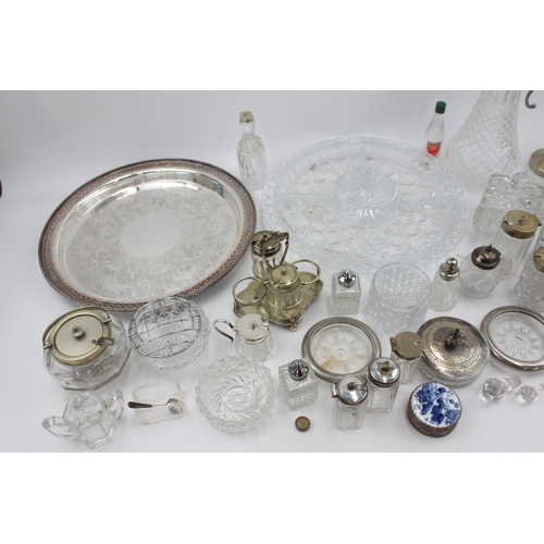 466 - A collection of vintage metalware and glassware to include cups, condiment sets, claret jug, tray et... 