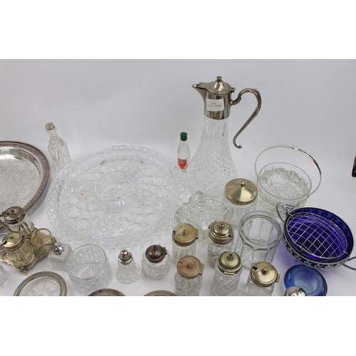 466 - A collection of vintage metalware and glassware to include cups, condiment sets, claret jug, tray et... 