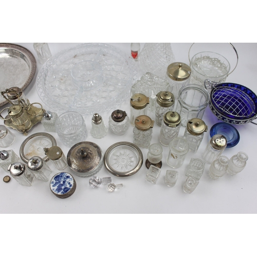 466 - A collection of vintage metalware and glassware to include cups, condiment sets, claret jug, tray et... 