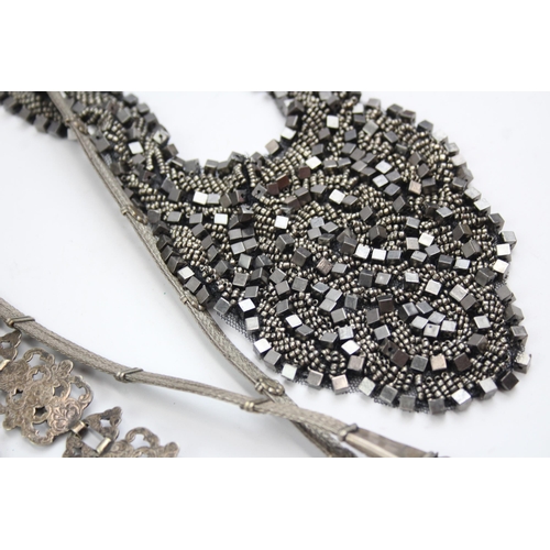 544 - Sixteen antique and vintage fashion accessories to include belts, necklaces etc.