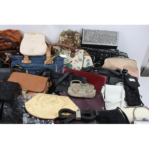 545 - A large collection of handbags