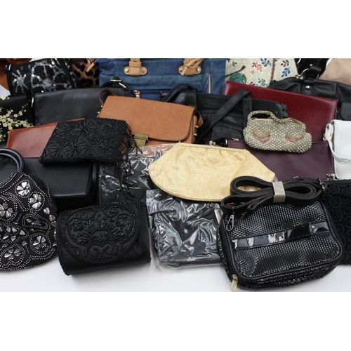 545 - A large collection of handbags