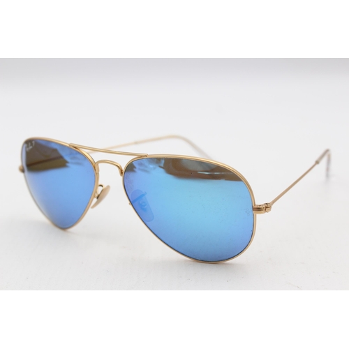 556 - A pair of cased Ray-Ban Aviator sunglasses with polarized lenses