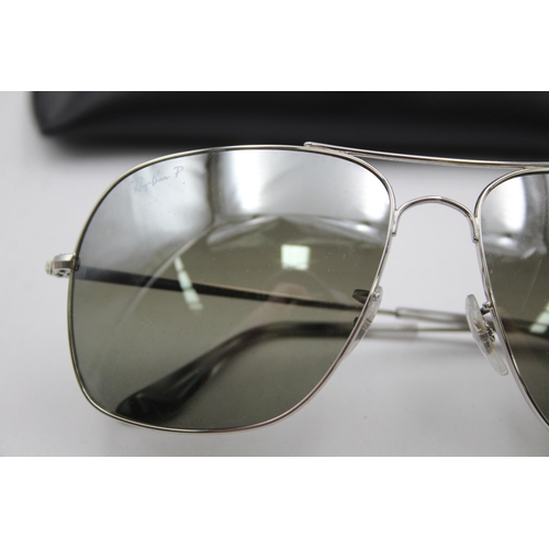 557 - A pair of cased Ray-Ban Chromance oversized sunglasses with polarized lenses