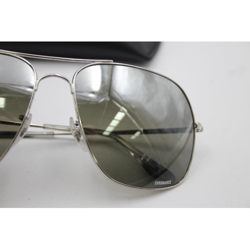 557 - A pair of cased Ray-Ban Chromance oversized sunglasses with polarized lenses