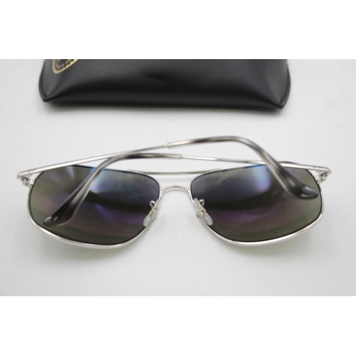 557 - A pair of cased Ray-Ban Chromance oversized sunglasses with polarized lenses