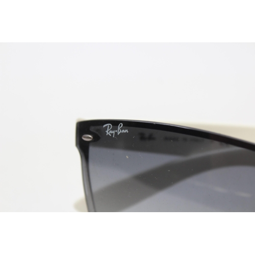 558 - A pair of cased Ray-Ban Y2K style frameless sunglasses