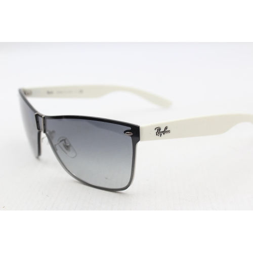 558 - A pair of cased Ray-Ban Y2K style frameless sunglasses