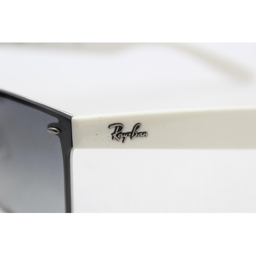 558 - A pair of cased Ray-Ban Y2K style frameless sunglasses