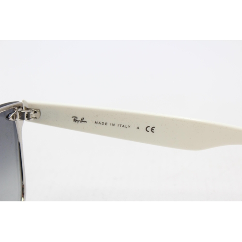 558 - A pair of cased Ray-Ban Y2K style frameless sunglasses