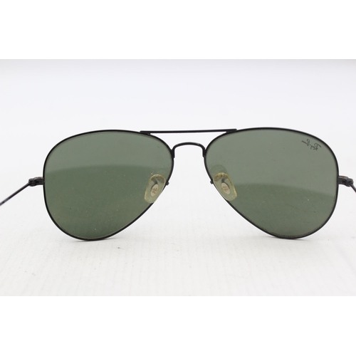 565 - A pair of cased Ray-Ban Aviator style sunglasses