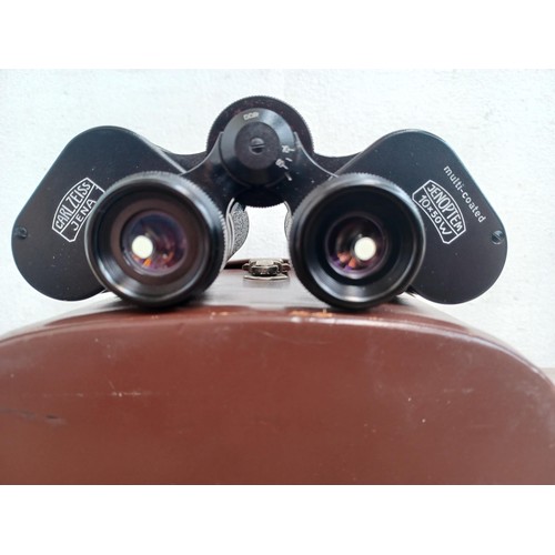 679 - A cased pair of Carl Zeiss Jenoptem 10 x 50w binoculars