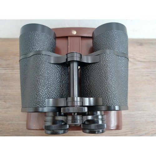 679 - A cased pair of Carl Zeiss Jenoptem 10 x 50w binoculars