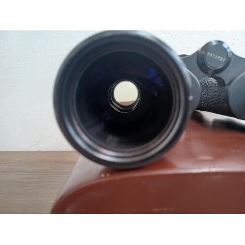 679 - A cased pair of Carl Zeiss Jenoptem 10 x 50w binoculars