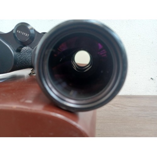 679 - A cased pair of Carl Zeiss Jenoptem 10 x 50w binoculars