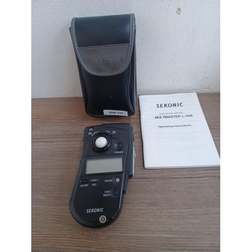 680 - Three items, one cased Sekonic Multimaster L-408 exposure meter with instruction manual, one boxed a... 