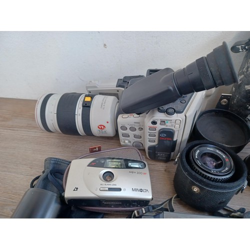 681 - A collection of camera equipment to include Canon Canovision EX1 Hi8 camcorder fitted with CL 8-120m... 