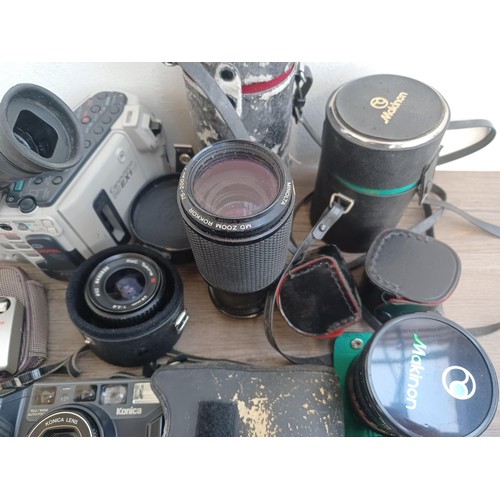 681 - A collection of camera equipment to include Canon Canovision EX1 Hi8 camcorder fitted with CL 8-120m... 