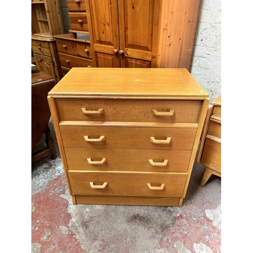 1 - A 1950s G Plan Brandon oak three piece bedroom suite comprising chest of four drawers, dressing tabl... 