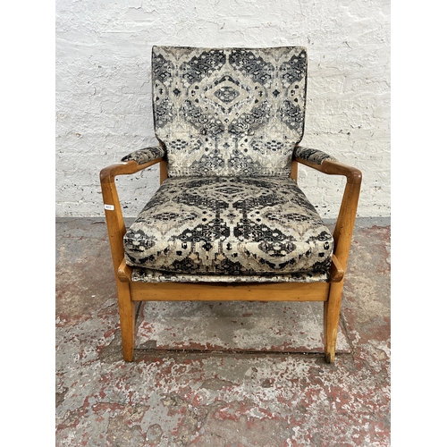 110 - A 1950s Cintique beech and recently upholstered patterned velvet armchair