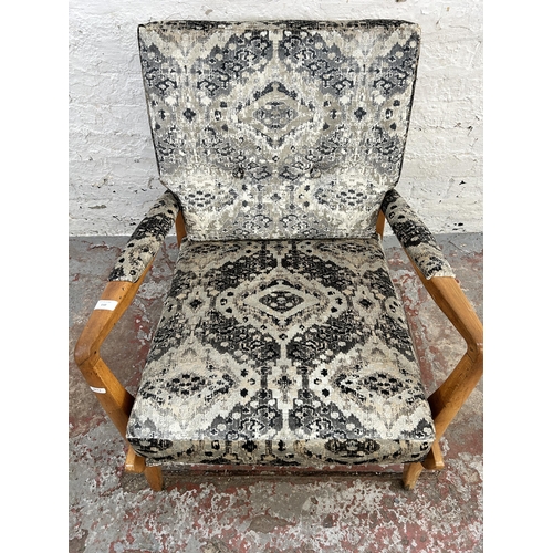 110 - A 1950s Cintique beech and recently upholstered patterned velvet armchair