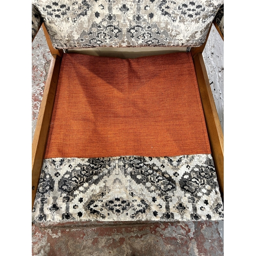 110 - A 1950s Cintique beech and recently upholstered patterned velvet armchair