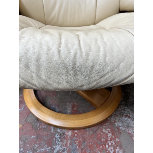 111 - A Stressless style cream leather and bentwood swivel reclining armchair and footstool