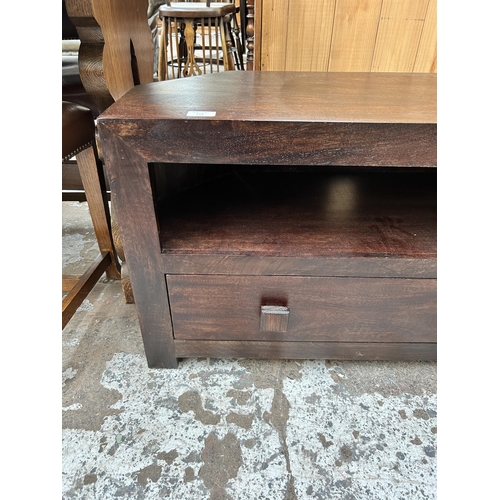 114 - A mango wood TV stand