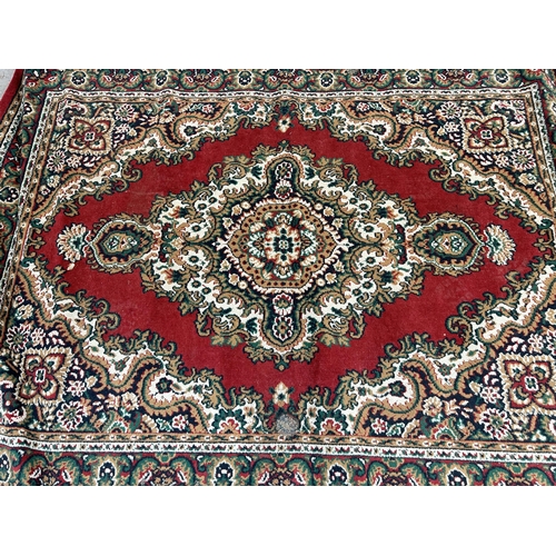 129 - A Belgian red rug - approx. 220cm x 160cm