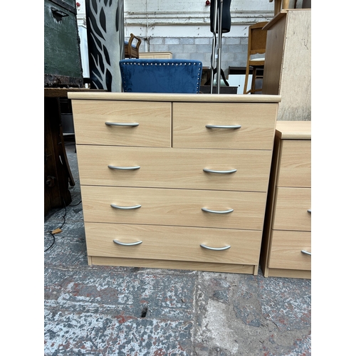 130 - Three pieces of beech effect bedroom furniture, two bedside chests of three drawers and one chest of... 