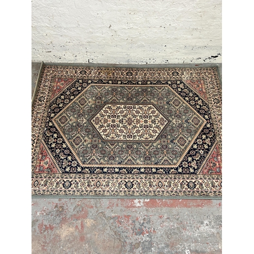 154 - A Royal Kirman 100% wool rug - approx. 200cm x 140cm