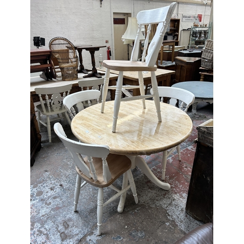 157 - A beech and white painted circular pedestal dining table and four dining chairs