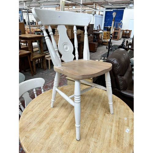 157 - A beech and white painted circular pedestal dining table and four dining chairs