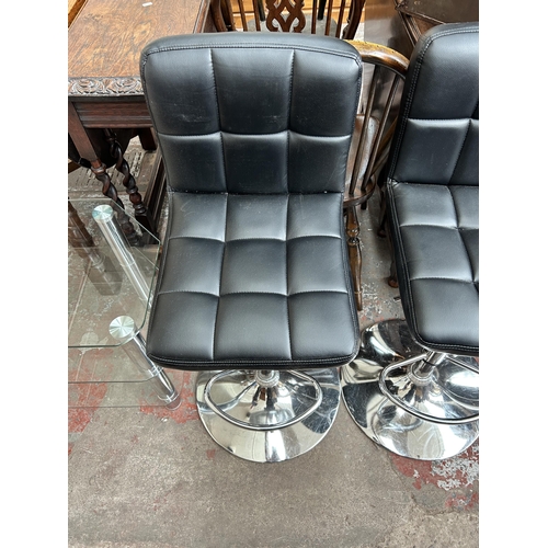 169 - Four black leatherette and chrome plated kitchen barstools
