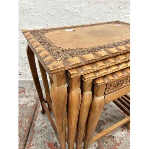 19 - A Chinese carved hardwood quartetto nest of tables
