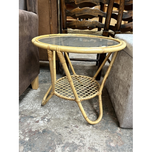 34 - Two pieces of furniture, one bamboo and glass circular two tier side table and one silver fabric uph... 