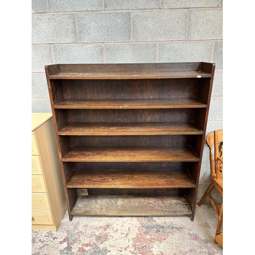 4 - A mid 20th century oak six tier free standing bookcase