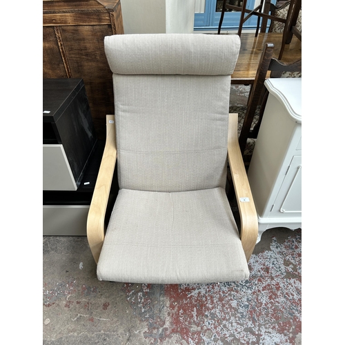 48 - An IKEA Poang bentwood and fabric upholstered armchair