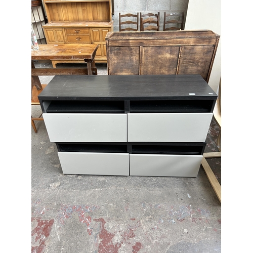 49 - Two modern black ash effect and grey plastic two drawer TV stands - both approx. 120cm wide