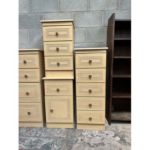 5 - A beech effect six piece bedroom suite comprising chest of five drawers, bedside chest of three draw... 