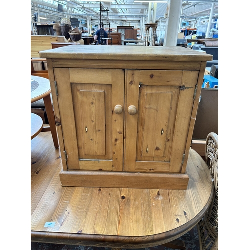 54 - A pine two door stereo cabinet