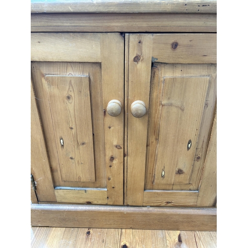 54 - A pine two door stereo cabinet