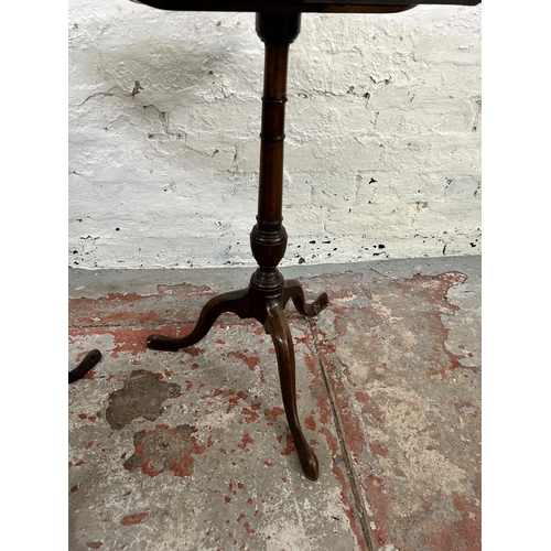 59 - Two Georgian walnut octagonal side tables on tripod pedestal supports - largest approx. 71cm high x ... 