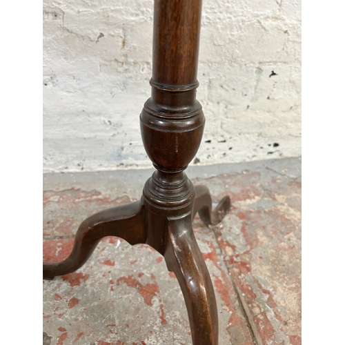 59 - Two Georgian walnut octagonal side tables on tripod pedestal supports - largest approx. 71cm high x ... 