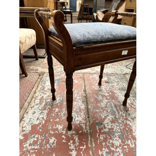 75 - An Edwardian beech and blue fabric upholstered piano stool