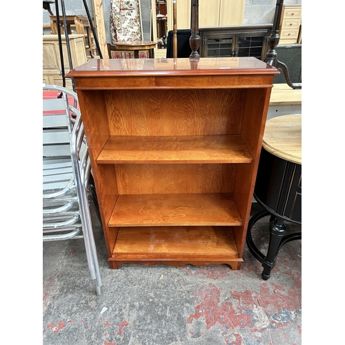 78 - A yew wood four tier free standing open bookcase