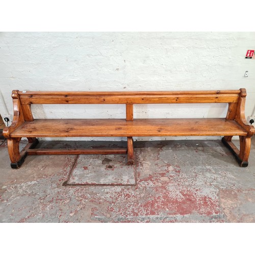 245 - A 19th century Augustus Pugin style pine church pew - approx. 80cm high x 265cm long x deep