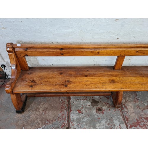 245 - A 19th century Augustus Pugin style pine church pew - approx. 80cm high x 265cm long x deep